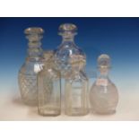 FIVE VARIOUS CUT GLASS DECANTERS AND STOPPERS.