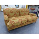 A BESPOKE HOWARD STYLE DEEP SEAT SETTEE UPHOLSTERED IN JIM DICKENS FABRIC WITH FEATHER FILLED