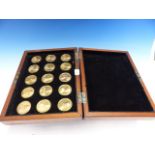 A MAHOGANY CASED SET OF FIFTEEN GILT MEDALLIONS DEPICTING THE BRITISH MONARCHS FROM WILLIAM II TO