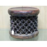 A BAMILEKE SPIDER STOOL, THE DISHED CIRCULAR SEAT LEATHER COVERED. Dia. 35cms