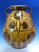 A WILLIAM AULT TWO HANDLED OVOID VASE WITH BROWN AND OCHRE SGRAFFITO SECESSIONIST DECORATION. H