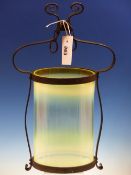 A CYLINDRICAL VASELINE GLASS CEILING LIGHT WITH IRON MOUNTS. H 42cms.