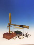 A BRASS STUDENTS MONOCULAR MICROSCOPE, A MAHOGANY MOUNTED BRASS THREE DRAWER TELESCOPE, THE