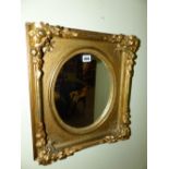 A PAIR OF OVAL PLATE WALL MIRRORS WITH 19th.C.GILT FRAMES. 39 x 44cms. (2)