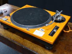 A RARE VINTAGE TECHNICS SL1200 MK2 RECORD DECK WITH ORANGE COVER.