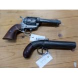 TWO REPRODUCTION SIX GUN PISTOLS, THE PERCUSSION CAP EXAMPLED WITH REVOLVING BARREL. W 22cms. THE