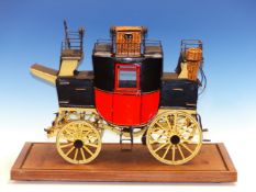 A MICHAT BOGAJEWICZ SCALE MODEL MAIL COACH WITH RED BODY AND YELLOW WHEELS, A WICKER BASKET