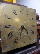 AN 18th.C.OAK CASED LONG CASE CLOCK WITH BRASS DIAL.