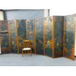 AN IMPRESSIVE PAIR OF VICTORIAN AESTHETIC FOUR FOLD SCREENS WITH HAND PAINTED LEATHER PANELS DEPICT
