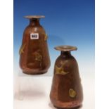 A PAIR OF ARTS AND CRAFTS HAND MADE COPPER VASES WITH BRASS DECORATION. H.23cms.
