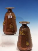 A PAIR OF ARTS AND CRAFTS HAND MADE COPPER VASES WITH BRASS DECORATION. H.23cms.