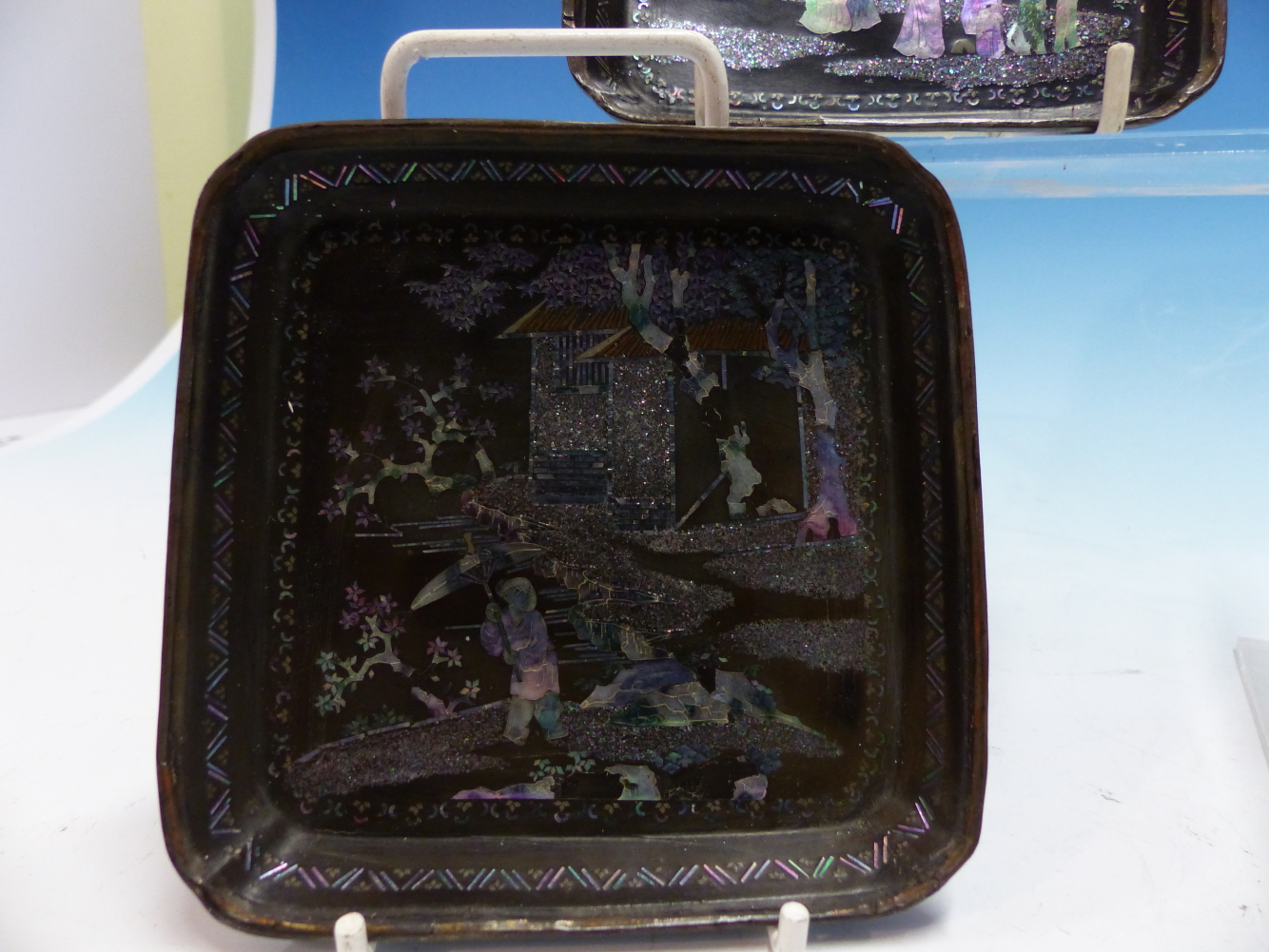 A PAIR OF LAC BURGAUTE SQUARE TRAYS, THE METAL MOUNTED RINGS ENCLOSING MOTHER OF PEARL FIGURES IN - Image 6 of 14