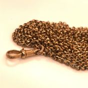 A 9CT GOLD MUFF GUARD BELCHER CHAIN, COMPLETE WITH DOG CLIP CLASP. LENGTH 150cms, WEIGHT 20.8grms.