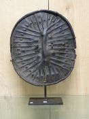 AN OROMO LEATHER SHIELD, THE OVAL RIM FOLDED AND ENCLOSING RIBS RADIATING FROM THE CENTRAL RIDGE.