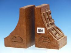 A PAIR OF MOUSEMAN OAK BOOK ENDS, THE CURVE OF ONE BRACKET SHAPE WITH M D IN RELIEF AND THE OTHER