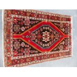 A PERSIAN HAMADAN RUG 210 x 147cms.