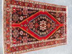 A PERSIAN HAMADAN RUG 210 x 147cms.