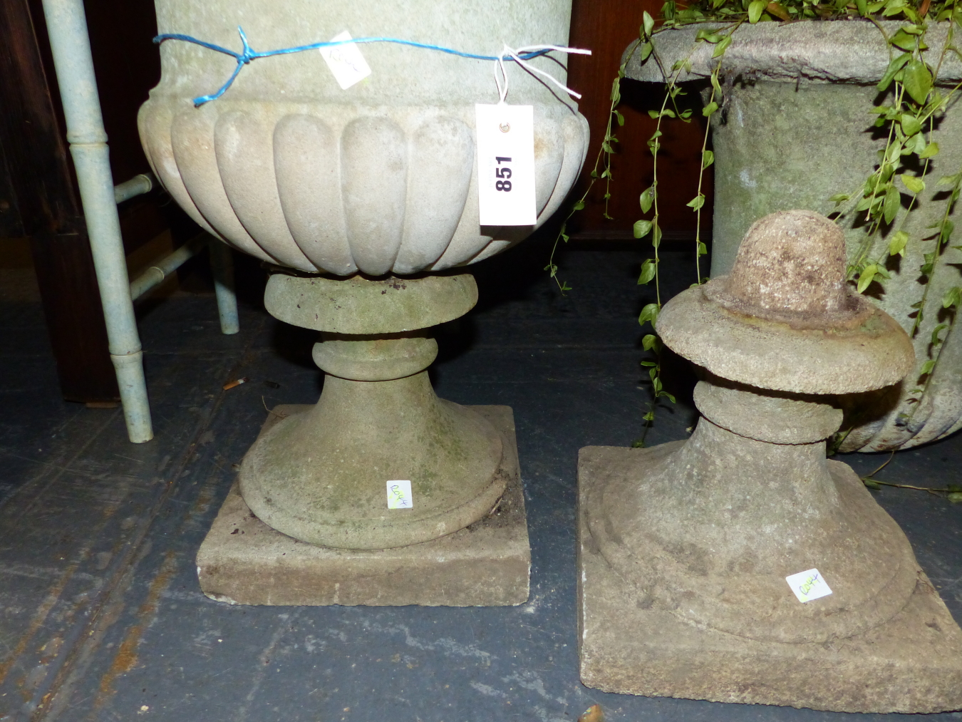 A PAIR OF COMPOSITE STONE CAMPANA URNS GADROONED ABOVE THE SOCLES RESTING ON SQUARE FEET. Dia. 53 - Image 3 of 4