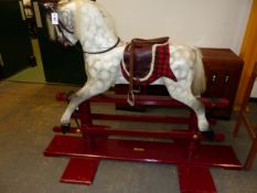 AN EARLY 20th.C.ROCKING HORSE ON TRESTLE BASE, RESTORED 2001 BY H&D CRAMMOND. HOOF TO EAR 97cms.