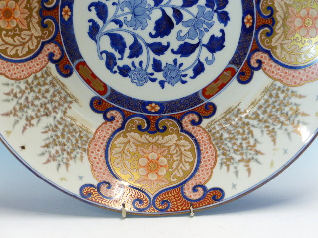 A FUKUGAWA IMARI DISH, THE RUYI FRAMED FLORAL LAPPETS ALTERNATING WITH STANDS OF BAMBOO AND - Image 4 of 18