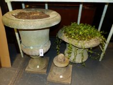 A PAIR OF COMPOSITE STONE CAMPANA URNS GADROONED ABOVE THE SOCLES RESTING ON SQUARE FEET. Dia. 53