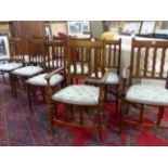 A SET OF TWELVE ARTS AND CRAFTS DINING CHAIRS IN THE MANNER OF LIBERTYS, (12)