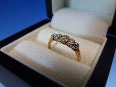 AN 18ct AND PLATINUM FIVE STONE OLD CUT DIAMOND GRADUATED HALF HOOP RING, RUBOVER SET ON A PLAIN