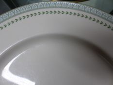 A DOULTON BERKSHIRE PATTERN DINNER SERVICE, EACH PIECE WITH OLIVE ANTHEMION BAND INSIDE A GILT