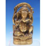 A POLISHED BRONZE METAL FIGURE OF GANESHA SEATED ON A LOTUS THRONE UNDER AND ARCHED MANDALA. H