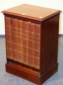 A MAHOGANY MUSIC CABINET, THE FRONT WITH SIX LEATHER BOOK SPINES LABELLED FOR TYPES OF MUSIC, EACH