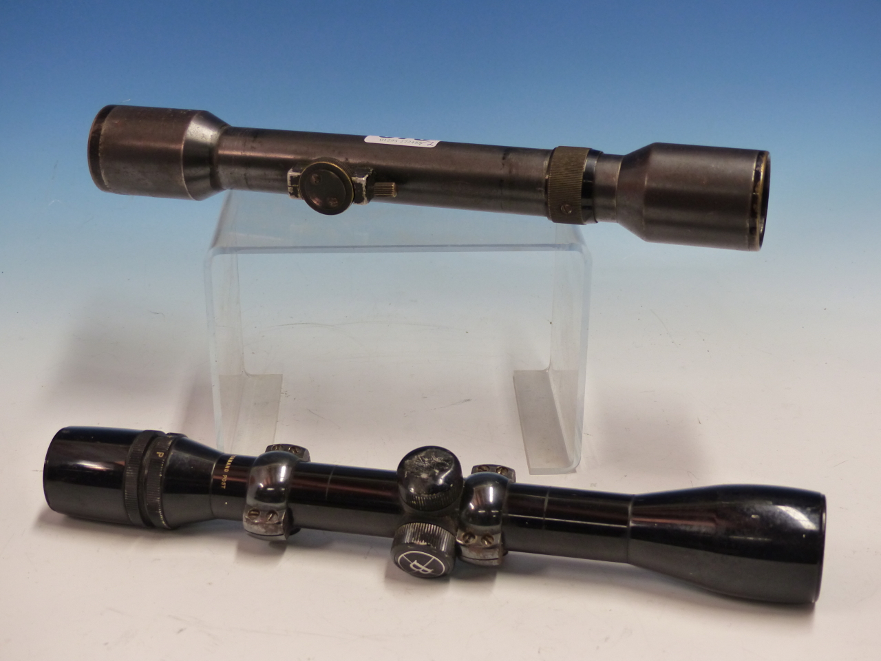 A BUSHNELL SCOPECHIEF IV 4X COMMAND POST TELESCOPIC SIGHT TOGETHER WITH A SCHUTZ JUSTOR 4X SCOPE.