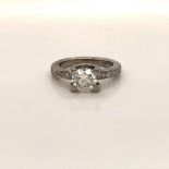 AN 18ct WHITE GOLD DIAMOND SOLITAIRE RING, CENTRALLY SET WITH A BRILLIANT CUT DIAMOND ESTIMATED