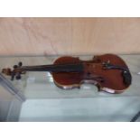 A CASED VIOLIN, THE BACK. 35.5 cms. THE OVERALL LENGTH. 61cms