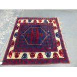 A TURKISH TRIBAL RUG 110 x 106cms.