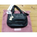 A RADLEY BLACK LEATHER HANDBAG WITH WHITE POKER DOT ZIP PULL AND LINING TOGETHER WITH A PINK TEXTILE