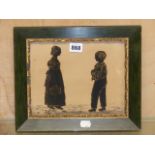 A 19th C. SILHOUETTE OF A BOY AND GIRL FACING EACH OTHER WHILE STANDING ON A LAWN WITHIN GILT SLIP
