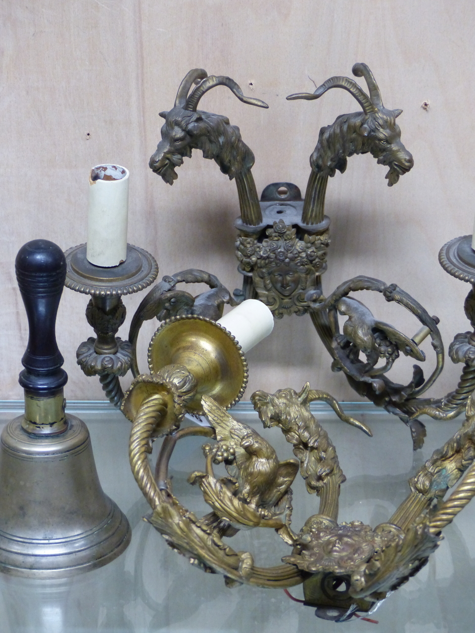 A PAIR OF ORMOLU TWO BRANCH WALL LIGHTS TOGETHER WITH A HANDBELL, THE FORMER WITH BACK PLATES TOPPED