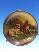 A PAPIER MACHE DISH PAINTED WITH TWA DOGS (sic) PLAYING BESIDE A LOCH, THE RIM METAL MOUNTED AND