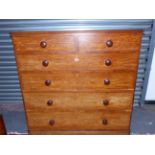 A LATE VICTORIAN MAHOGANY CHEST BY HEAL & SON, LONDON WITH TWO SHORT AND THREE LONG GRADUATED
