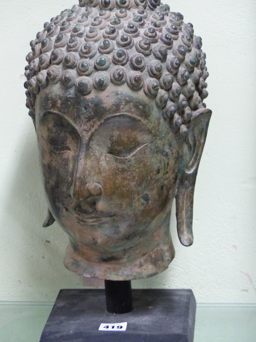 A THAI BRONZE HEAD OF THE BUDDHA, CURLED HAIR ABOVE HIS LONG LOBED EARS, HIS USNISA WITH FLAME - Image 2 of 10