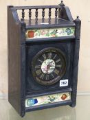 A VICTORIAN BLACK SLATE MANTLE CLOCK IN THE AESTHETIC TASTE WITH UNUSUAL PATENT WINDING MECHANISM.