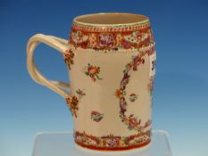 A CHINESE EXPORT MANDARIN PALETTE MUG PAINTED WITH A RESERVE OF FLOWERS OPPOSITE THE REEDED DOUBLE