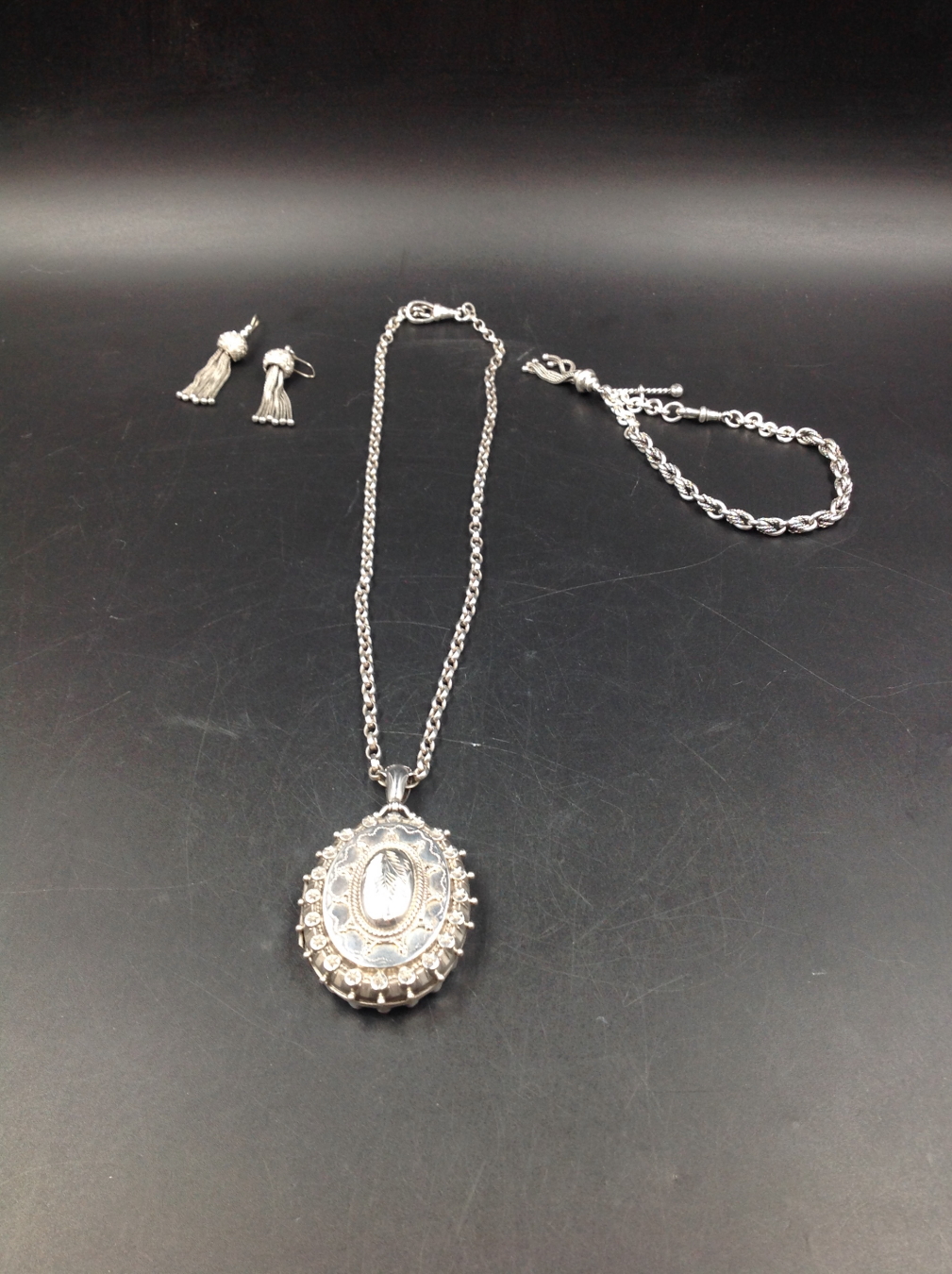 A VICTORIAN SILVER LARGE OVAL LOCKET COMPLETE WITH A SILVER BELCHER CHAIN FITTED WITH A SILVER