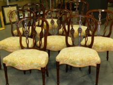 A SET OF EIGHT ADAMS STYLE MAHOGANY DINING CHAIRS ON CARVED AND FLUTED FORELEGS. (8)