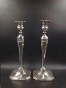 A PAIR OF AMERICAN STERLING STAMPED LOADED CANDLESTICKS. HEIGHT 32cms.