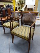 A PAIR OF INLAID MAHOGANY 19th.C.CANE BACK LIBRARY ARMCHAIRS IN THE REGENCY TASTE. (2)