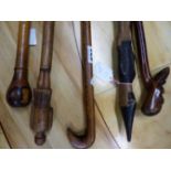 AN 1849 MEASURING STICK, ANOTHER WALKING CANE WITH PARQUETRY POMMEL HANDLE TOGETHER WITH THREE CANES