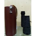 A LEATHER CASED CARL ZEISS 10 x 50 MONOCULAR.