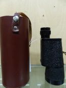 A LEATHER CASED CARL ZEISS 10 x 50 MONOCULAR.