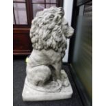 A PAIR OF COMPOSITION STONE LIONS SEATED ON RECTANGULAR BASES. H 89cms.